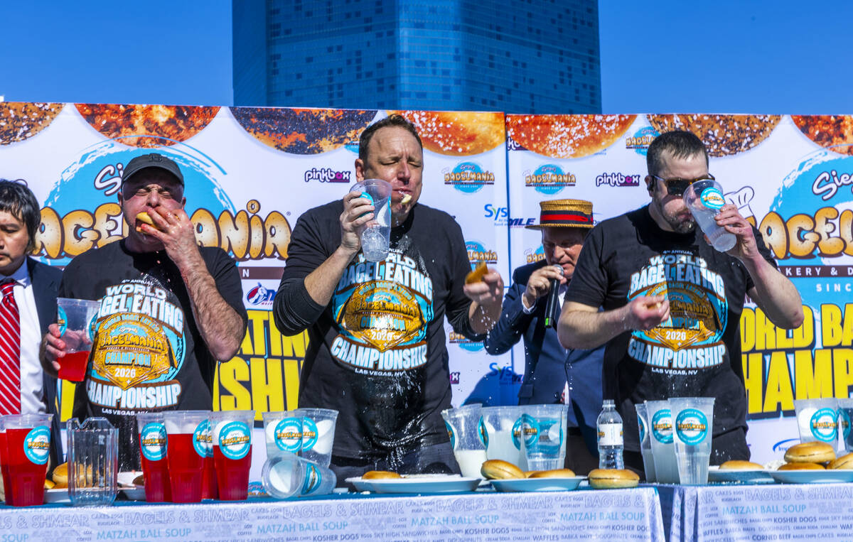 Competitors Geoffrey Esper, Joey Chestnut and Patrick Bertoletti devour bagels for the world ba ...