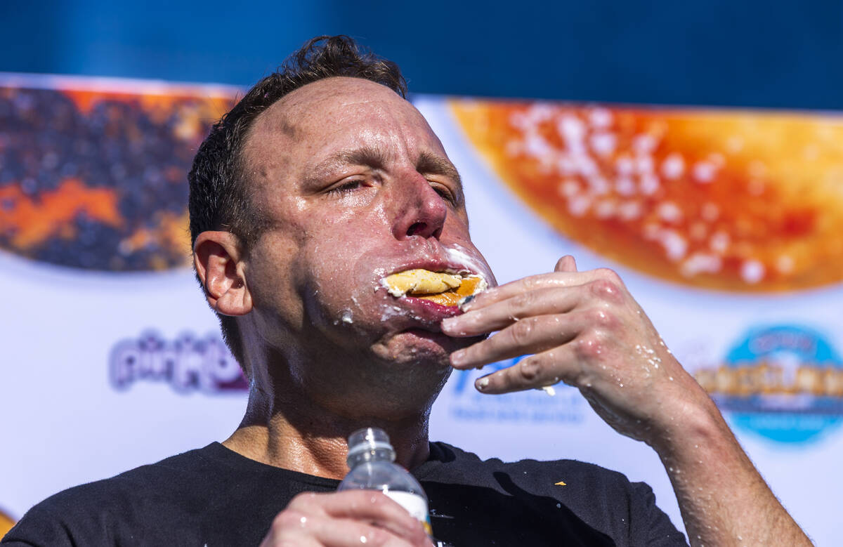 Joey Chestnut, the number-one-ranked competitive eater in the world, battles to eat a final bag ...