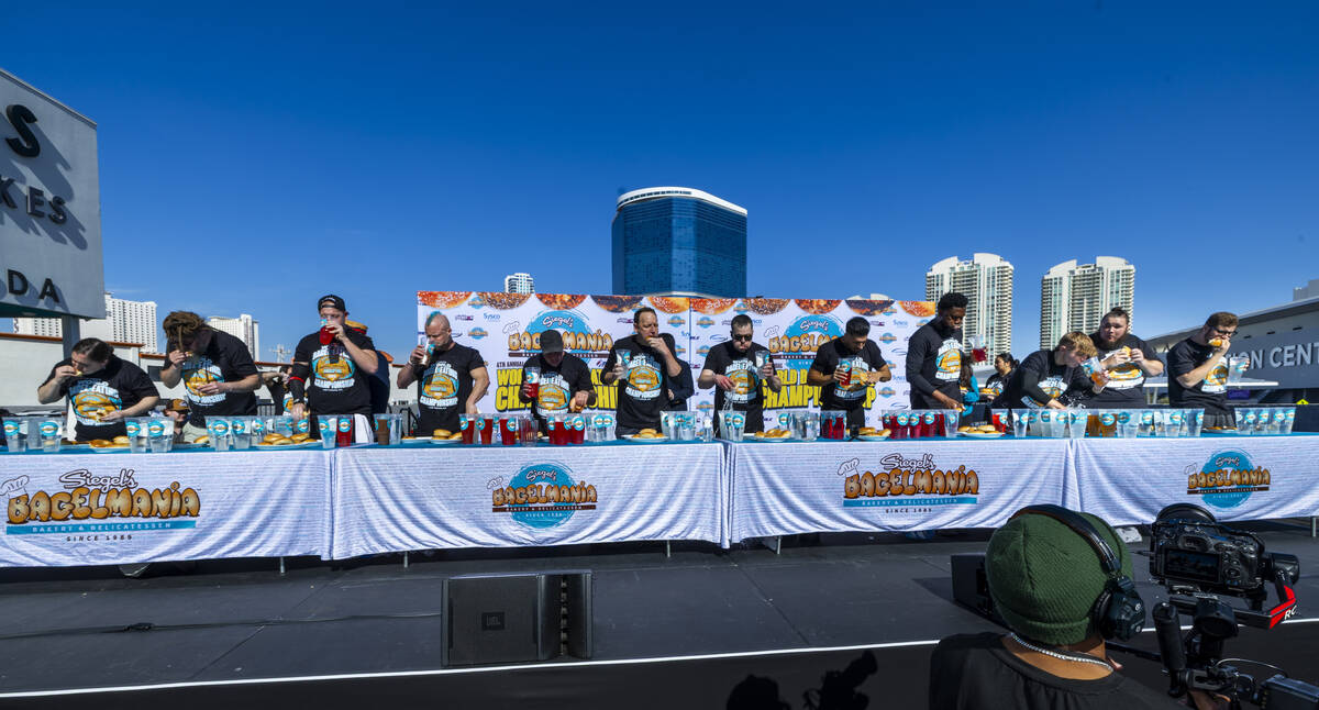 Major League Eating athletes eat bagels for eight minutes on stage during the fourth-annual Sie ...