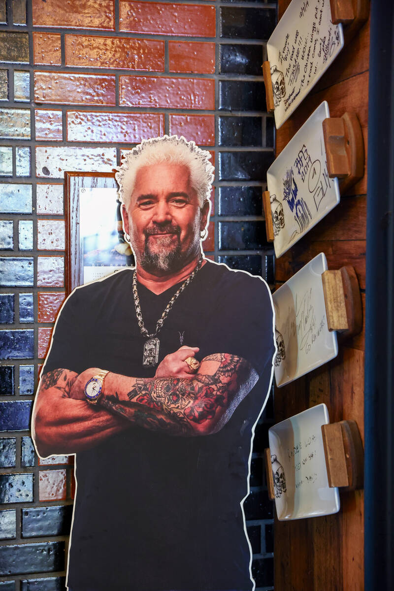 A cutout of Guy Fieri on Friday, Dec. 5, 2025 at Guy Fieri's Vegas Kitchen & Bar in Th ...
