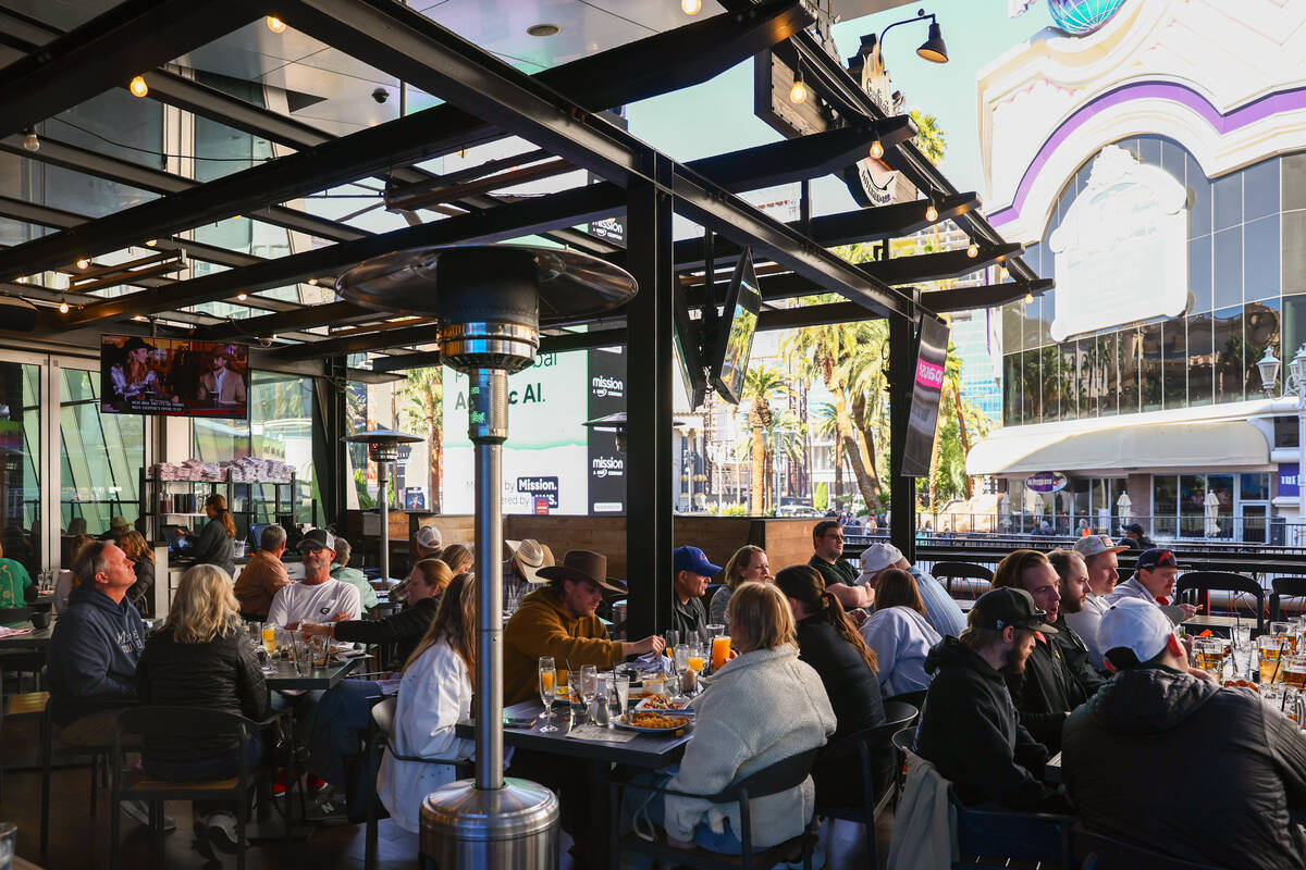 Diners eat on the balcony on Friday, Dec. 5, 2025 at Guy Fieri's Vegas Kitchen & Bar i ...