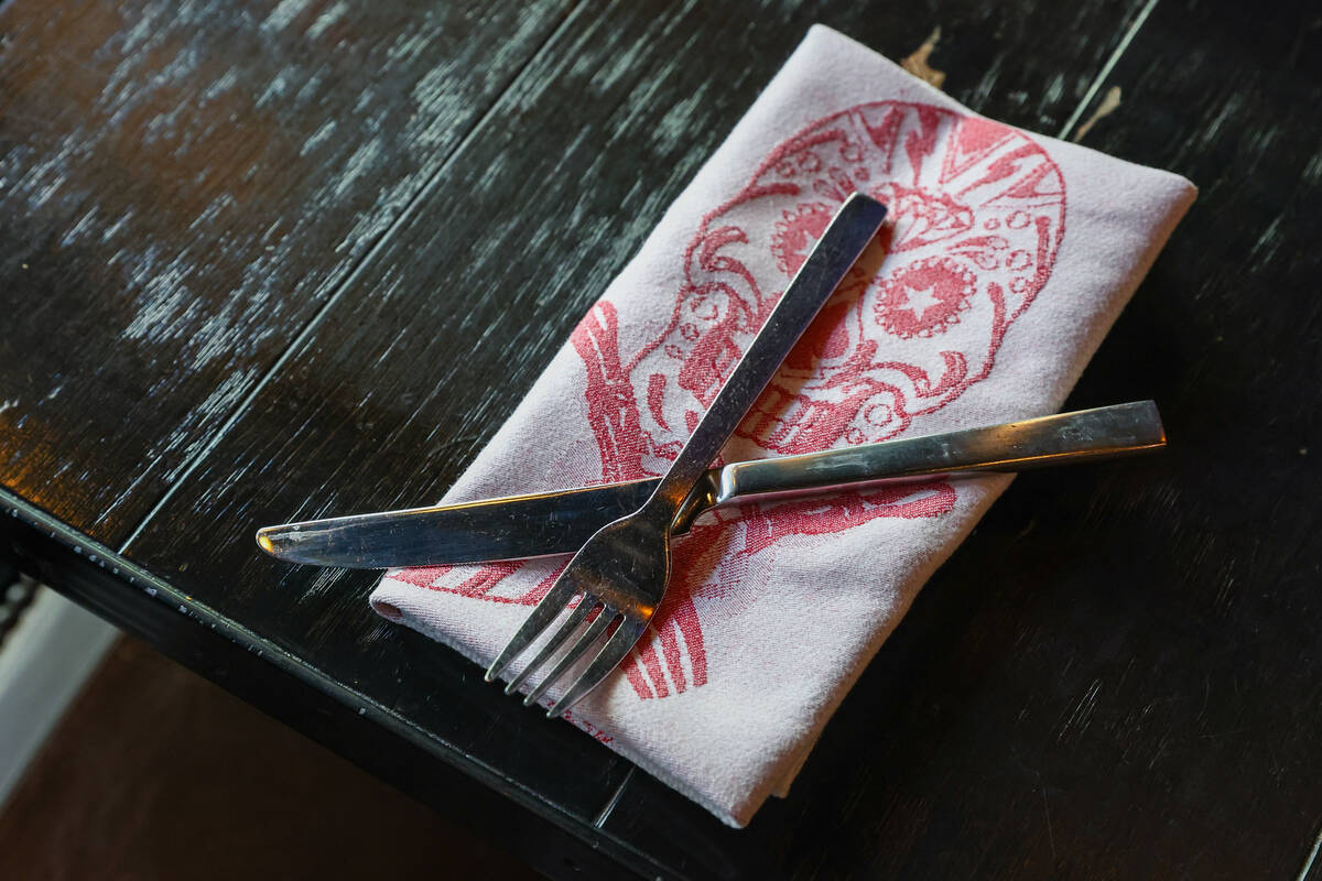 Utensils and a napkin sit on a table on Friday, Dec. 5, 2025 at Guy Fieri's Vegas Kitchen ...
