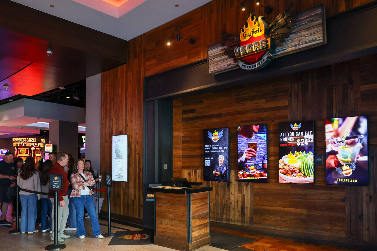People wait in line to enter Guy Fieri's Vegas Kitchen & Bar on Friday, Dec. 5, 2025 a ...