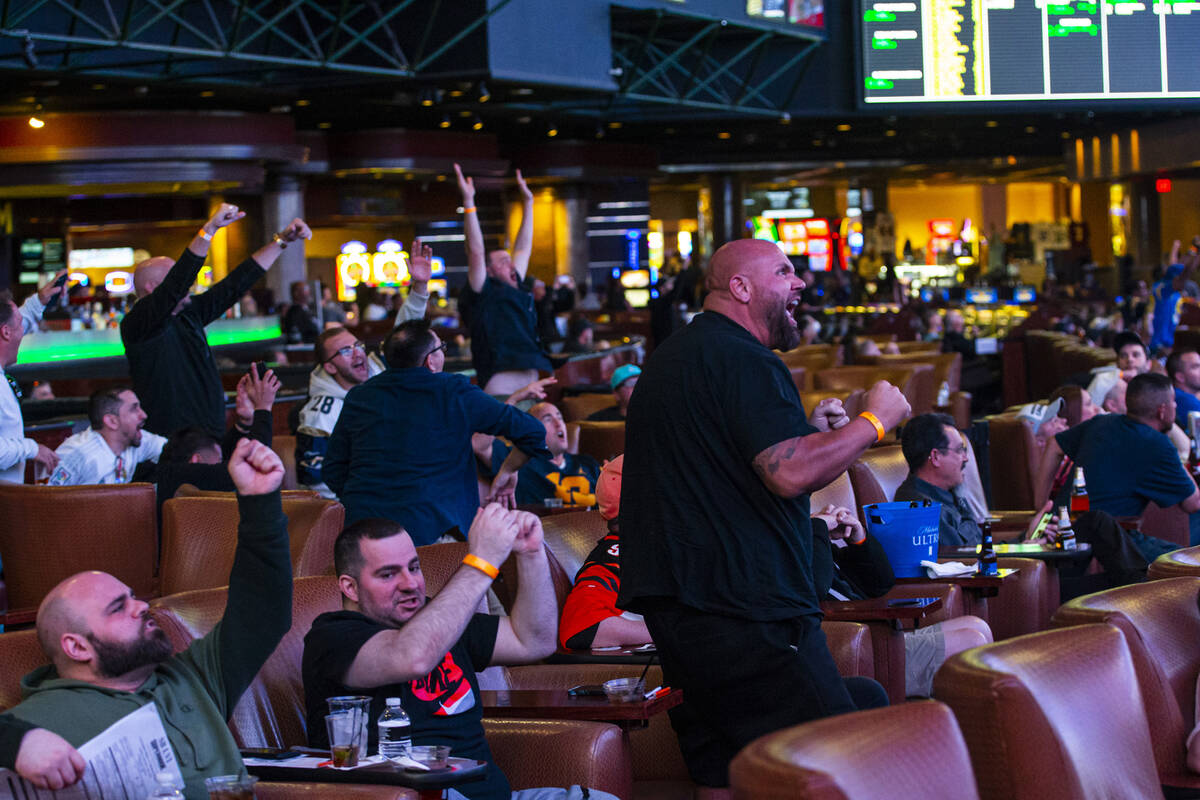 John O’Donnell, of Long Beach, right, cheers after a touchdown by Odell Beckham Jr. of t ...