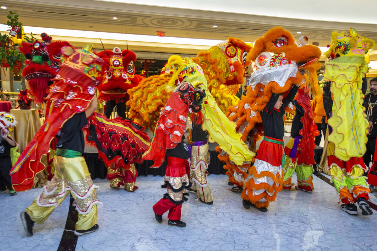 The Lohan School of Shaolin conduct a lion dance at a reception as the Grand Canal Shoppes cele ...