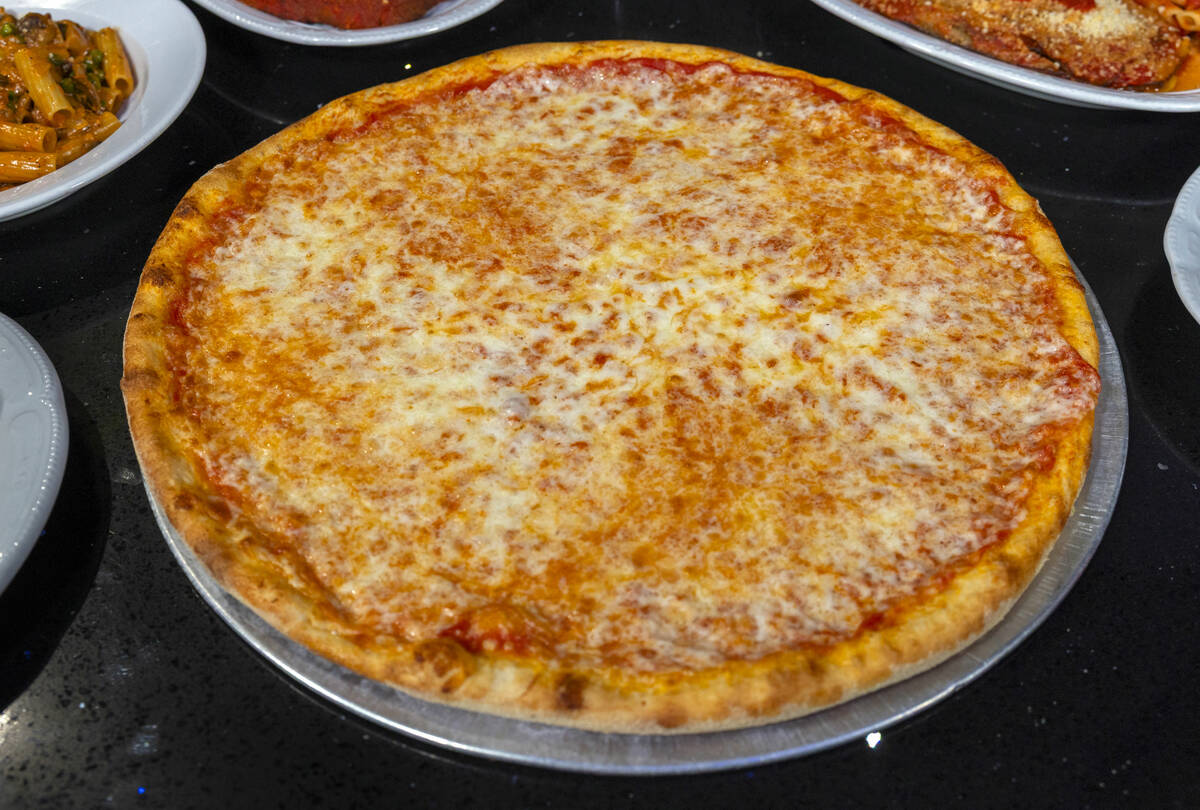 A cheese pizza from Carmine's Pizza Kitchen, which is celebrating its 50th anniversary in ...