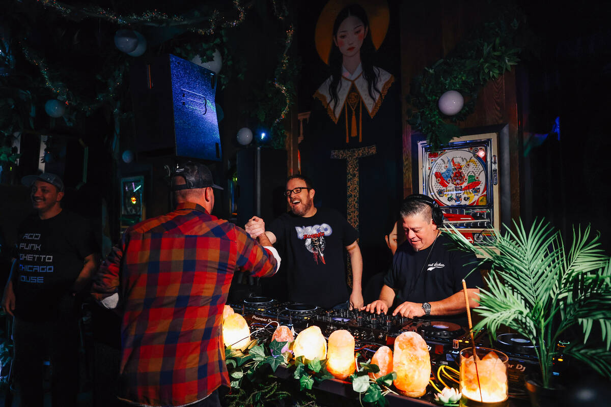Bar goers greet each other at Pachi Pachi in downtown Las Vegas Saturday, Jan. 24, 2026, in Las ...