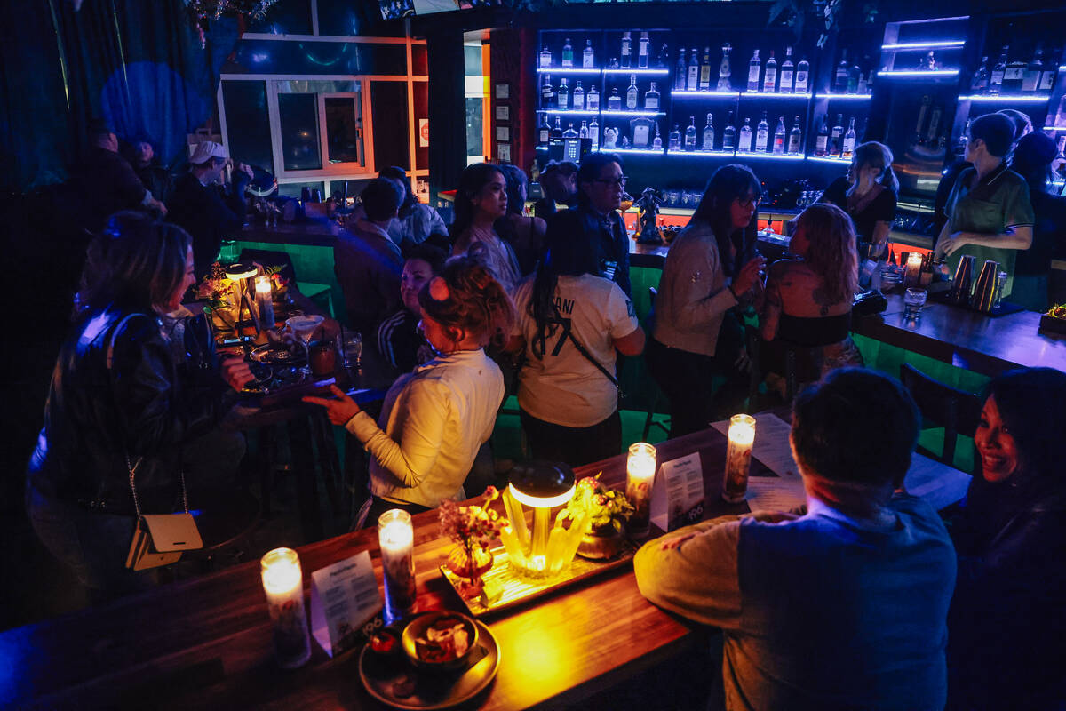 Bar goers sit at tables at Pachi Pachi in downtown Las Vegas Saturday, Jan. 24, 2026, in Las Ve ...