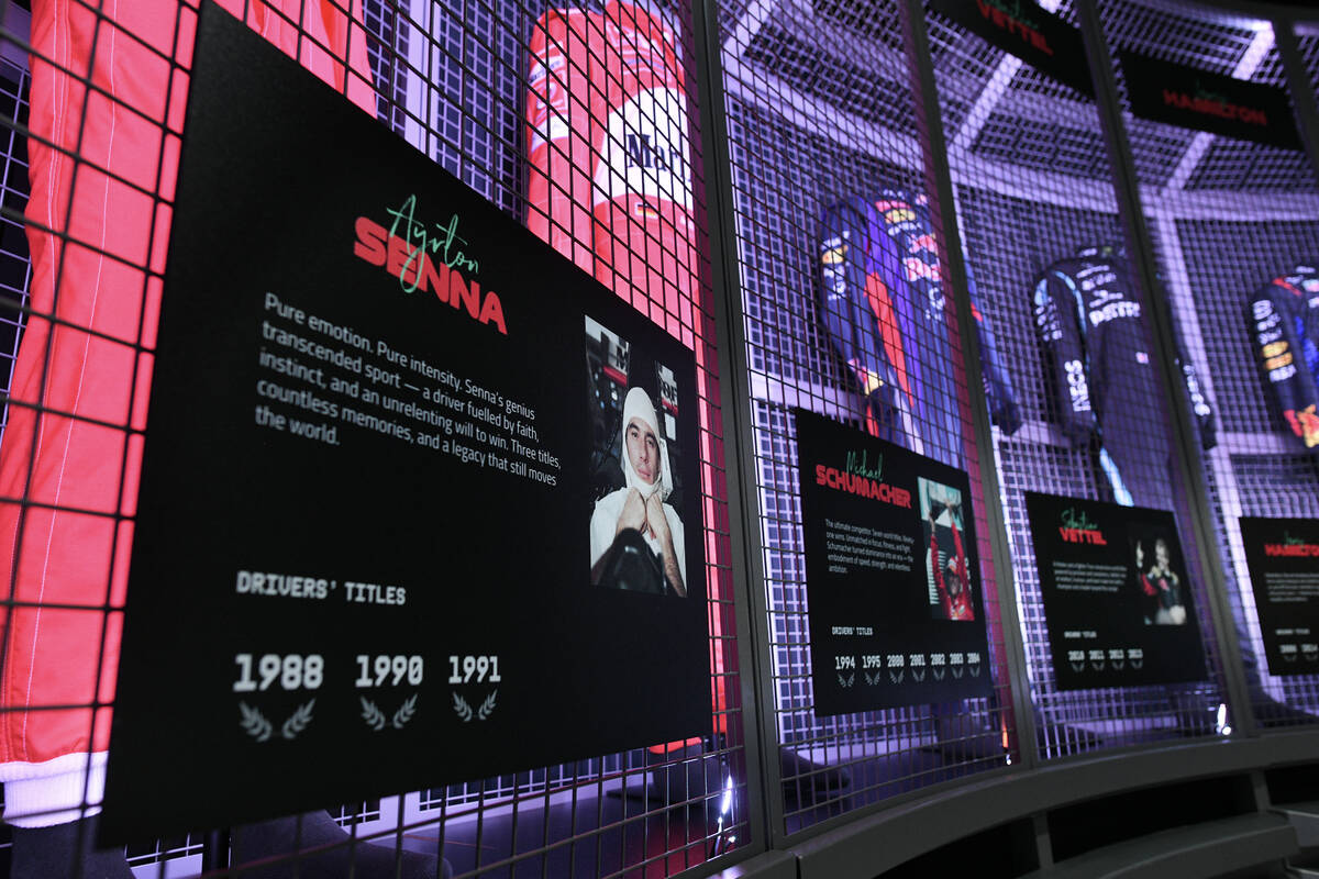 Firesuits from F1 champions are seen on display during the reopening of Grand Prix Plaza Friday ...