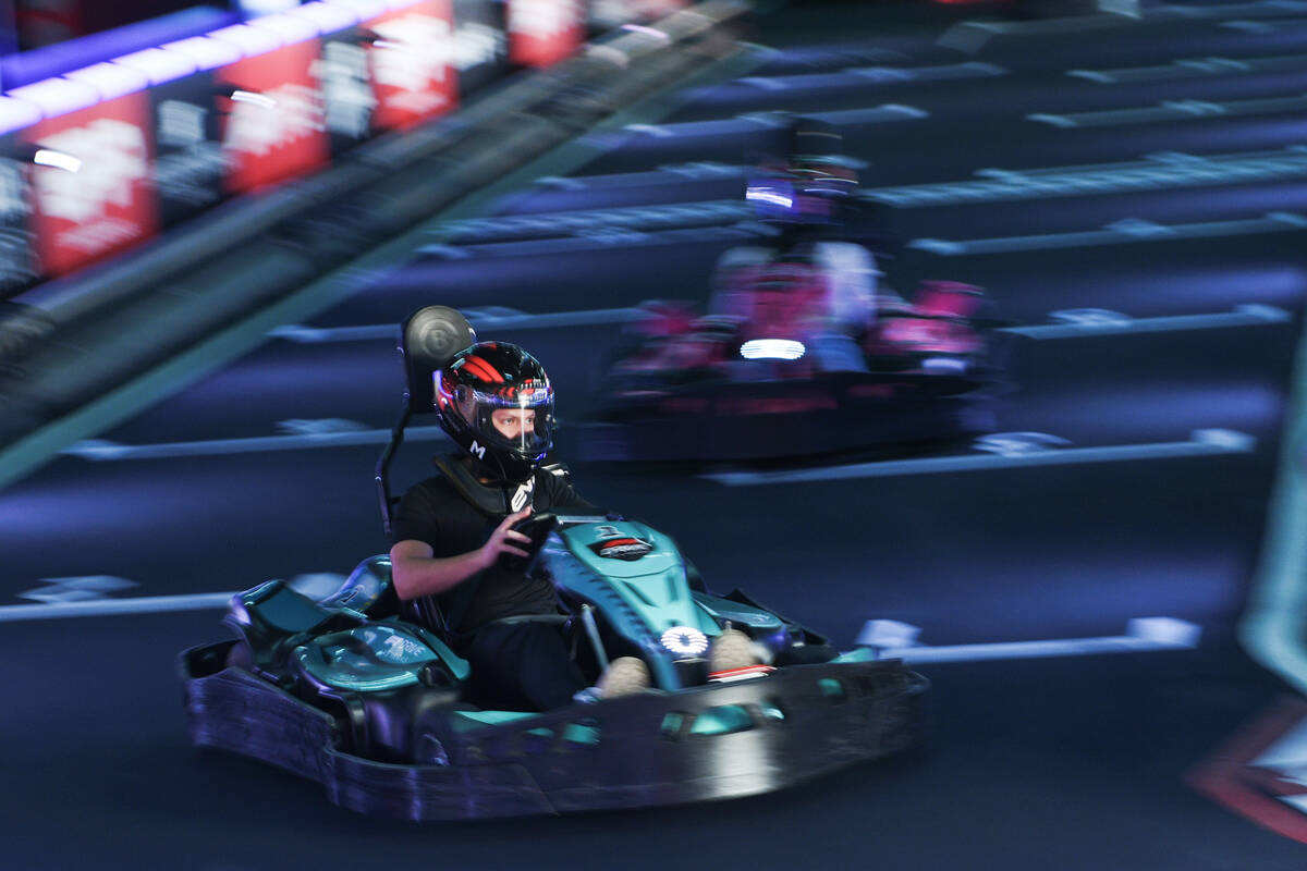 Participants race on the F1 Go Kart Track during the reopening of Grand Prix Plaza Friday, Janu ...