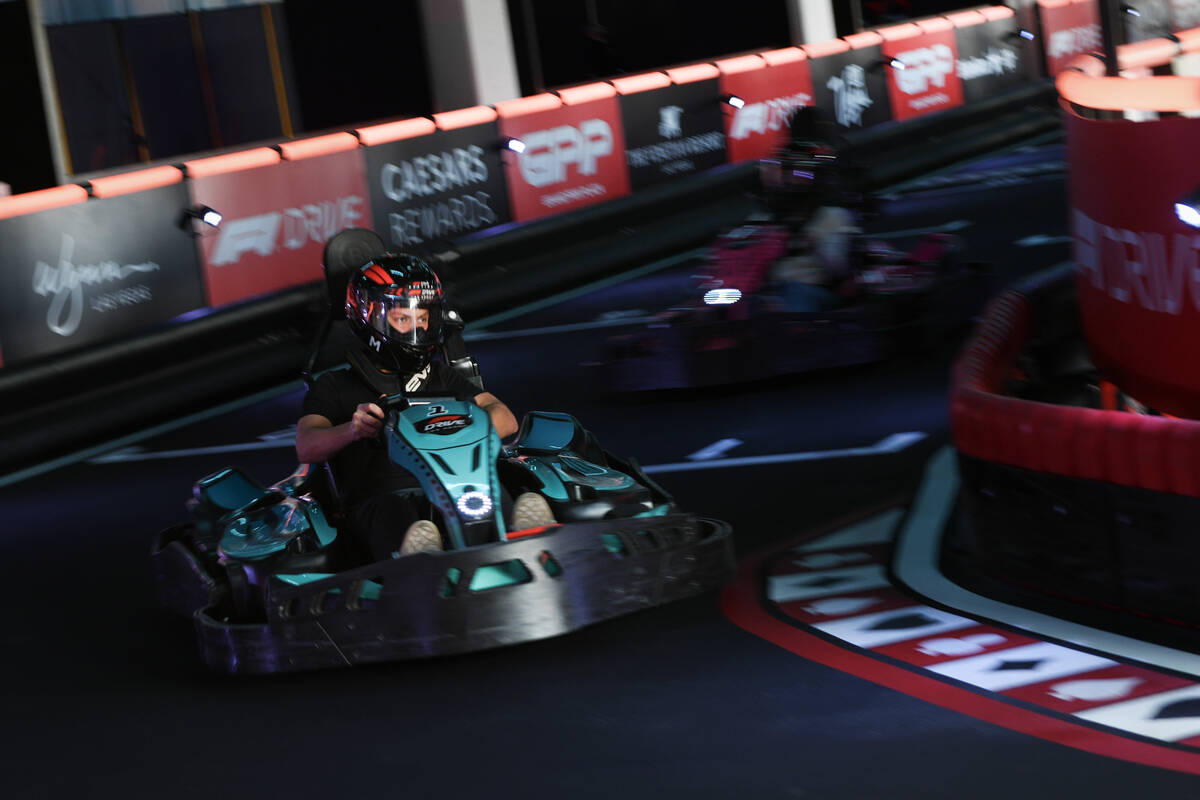 Participants race on the F1 Go Kart Track during the reopening of Grand Prix Plaza Friday, Janu ...