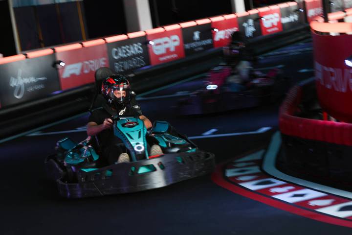 Participants race on the F1 Go Kart Track during the reopening of Grand Prix Plaza Friday, Janu ...
