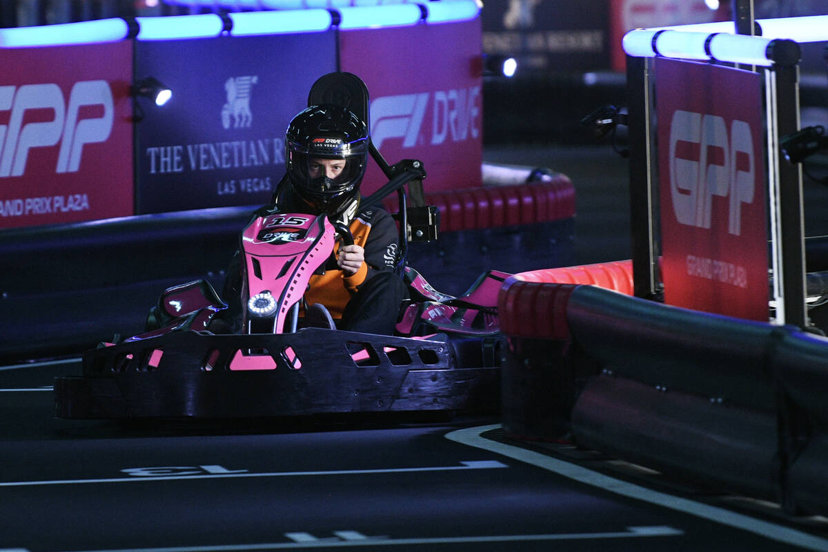 Participants race on the F1 Go Kart Track during the reopening of Grand Prix Plaza Friday, Janu ...