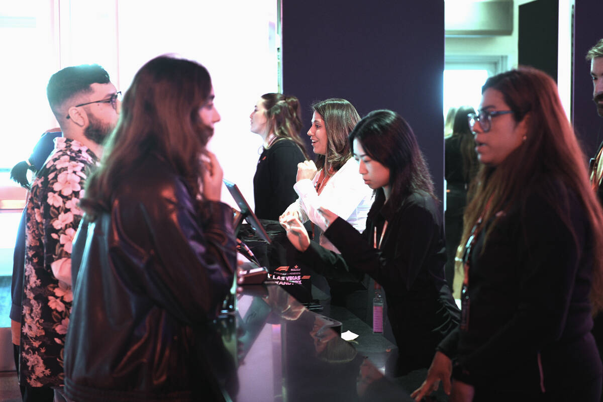 Guests check in during the reopening of Grand Prix Plaza Friday, January 30, 2026, in Las Vegas ...