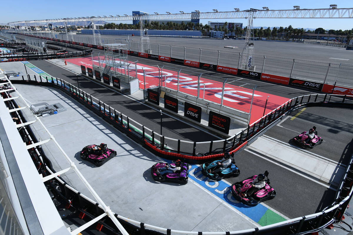 Participants race on the F1 Go Kart Track during the reopening of Grand Prix Plaza Friday, Janu ...