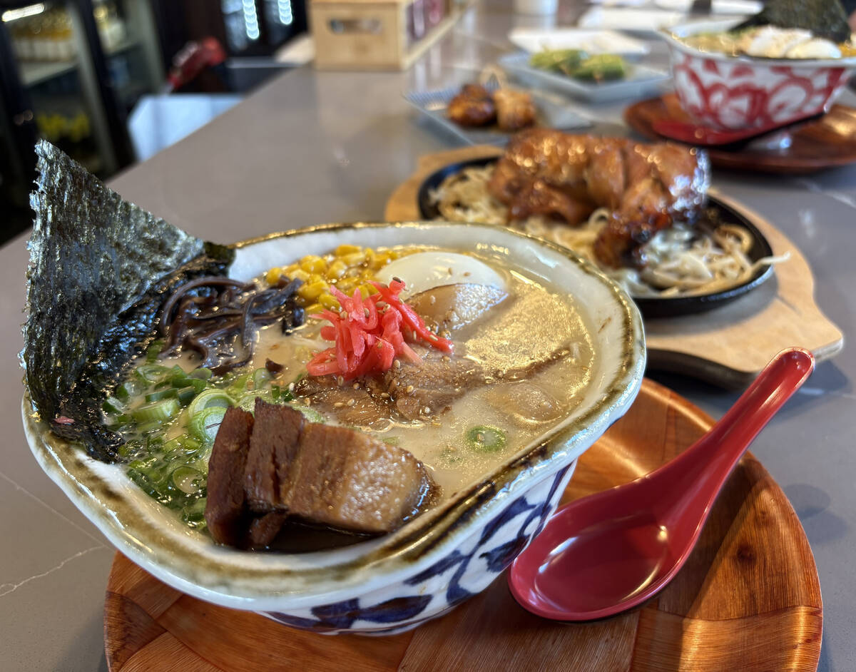 Hakata tonkotsu ramen, front, and a grilled chicken thigh with chicken paitan DX ramen, at the ...