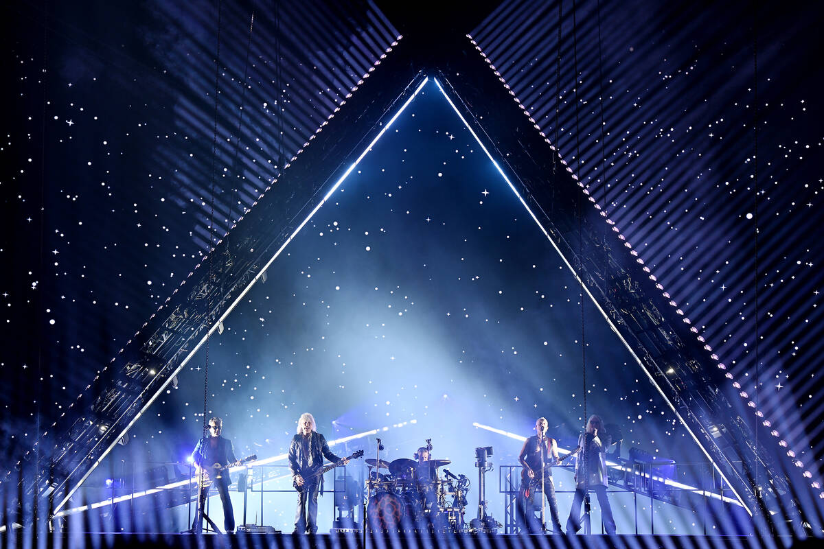 LAS VEGAS, NEVADA - FEBRUARY 03: Guitarist Vivian Campbell, bass guitarist Rick Savage, drummer ...