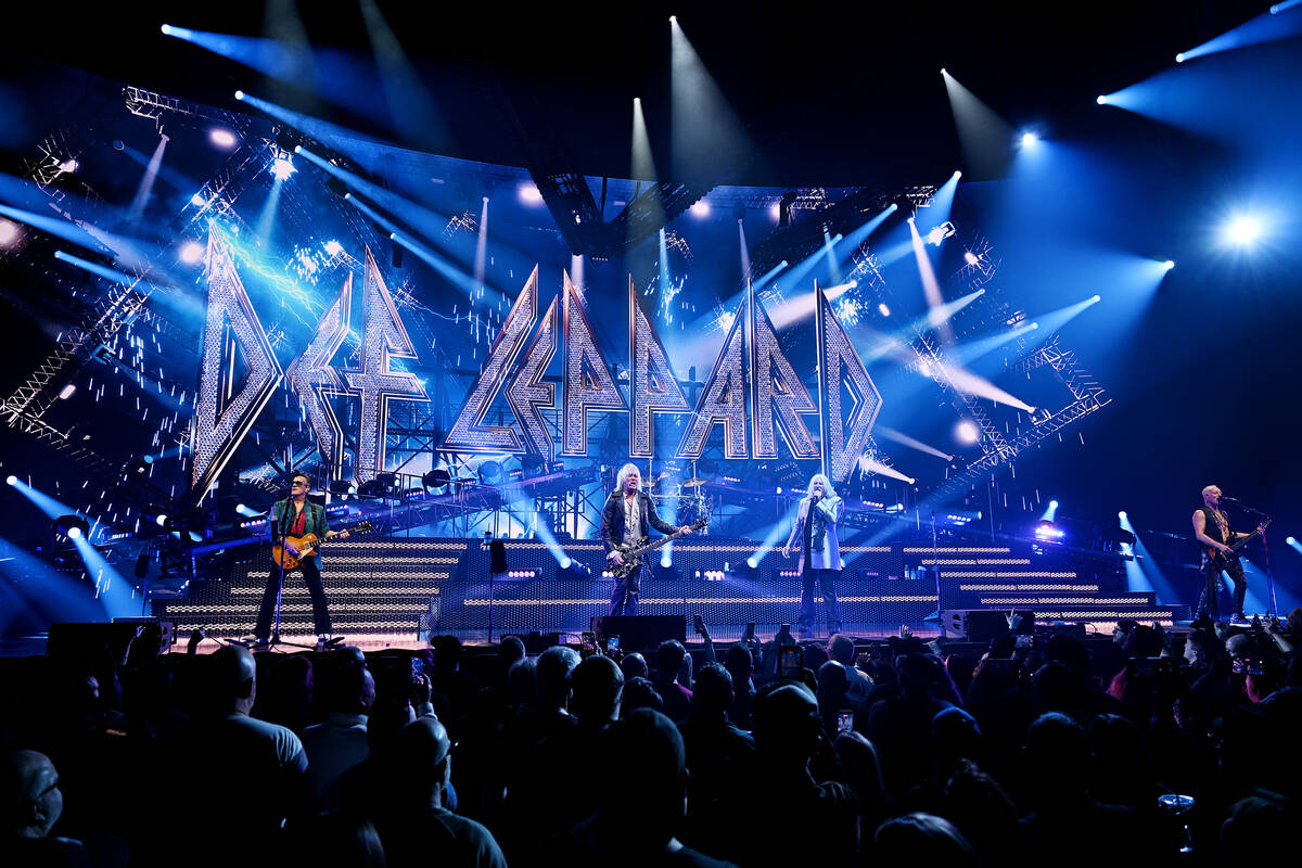 LAS VEGAS, NEVADA - FEBRUARY 03: Guitarist Vivian Campbell, bass guitarist Rick Savage, drummer ...