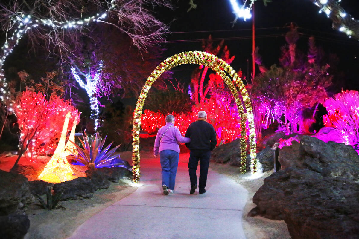 A couple enjoys Lights of Love at Ethel M Chocolate Factory and Cactus Garden on Monday, Feb. 1 ...