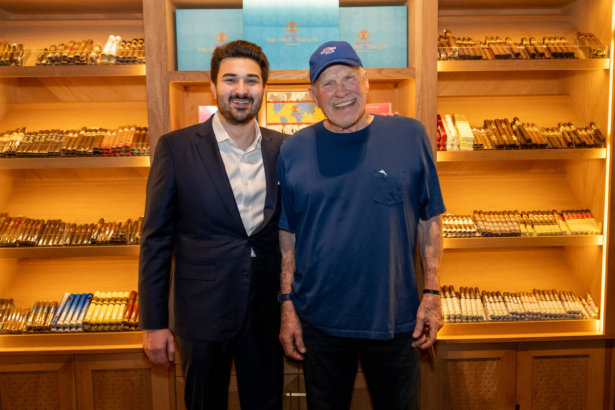 Eight Lounge co-founder Giuseppe Bravo is shown with Terry Bradshaw in the club's humidor on Su ...