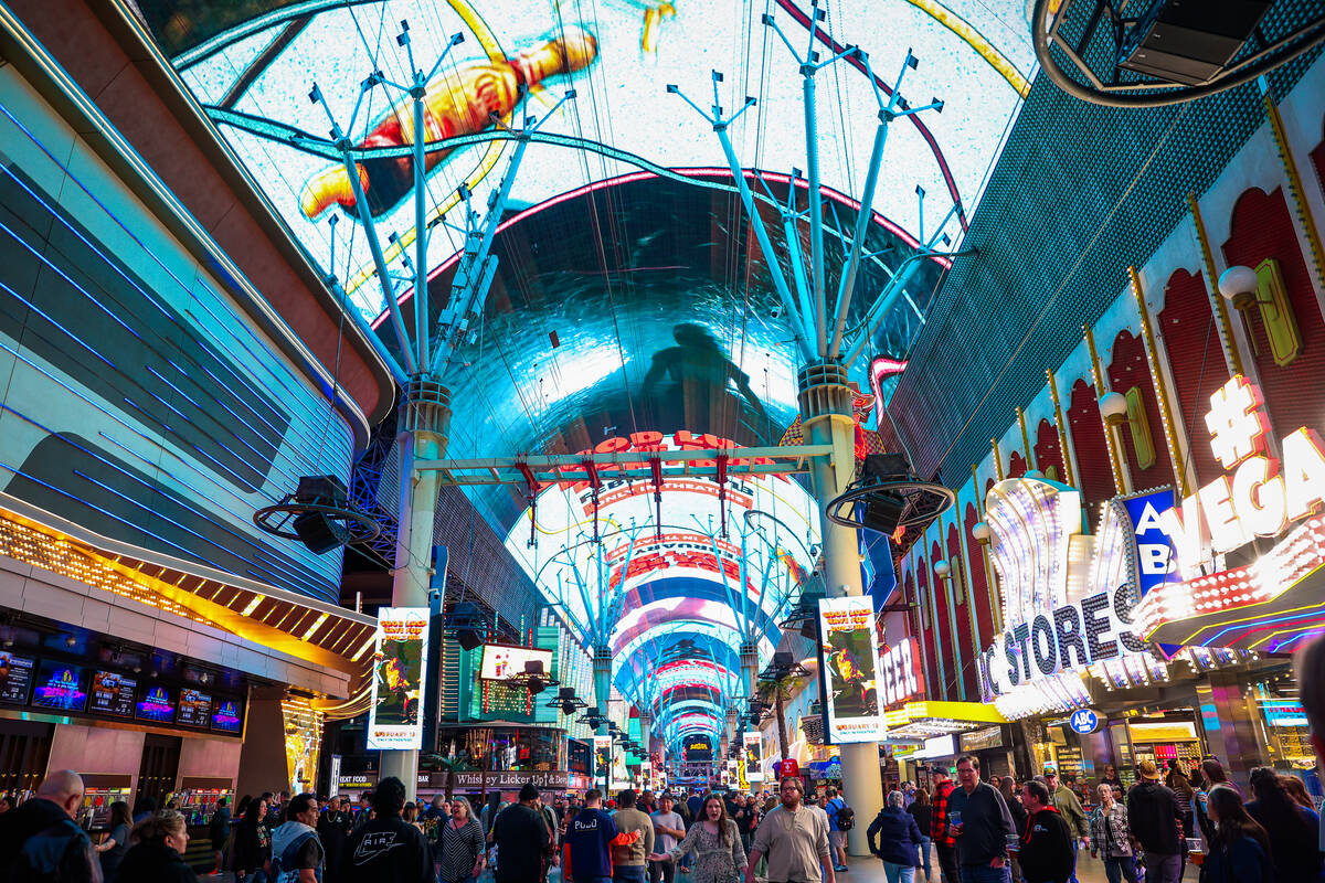 The canopy on Fremont Street is lit up during a pop-up event promoting new film “Good Lu ...