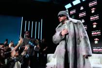 Apple Music Super Bowl LX Halftime Show performer Bad Bunny speaks to the crowd after a news co ...
