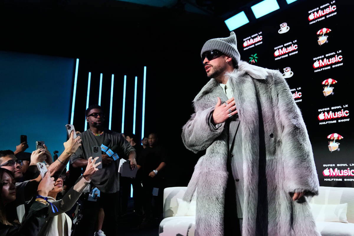 Apple Music Super Bowl LX Halftime Show performer Bad Bunny speaks to the crowd after a news co ...