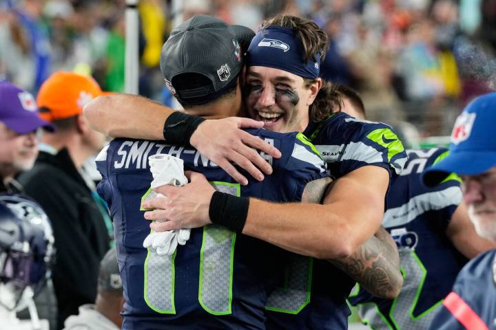 Seattle Seahawks wide receiver Jaxon Smith-Njigba (11) celebrates with wide receiver Jake Bobo ...