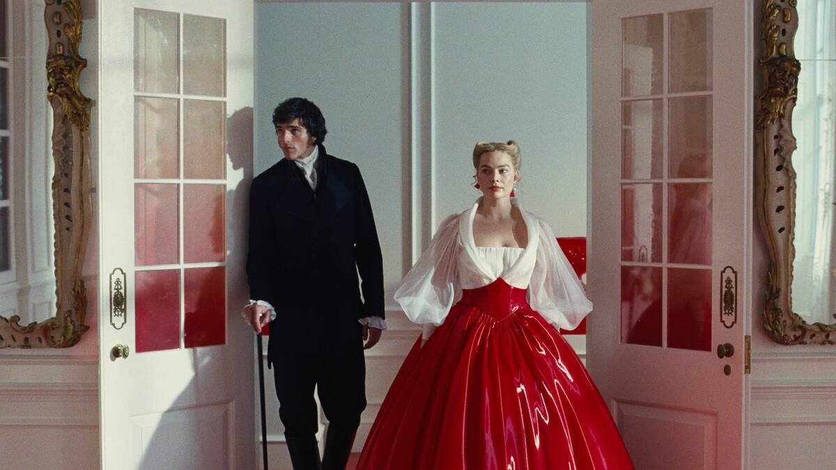 This image released by Warner Bros. Pictures shows Jacob Elordi and Margot Robbie in a scene fr ...