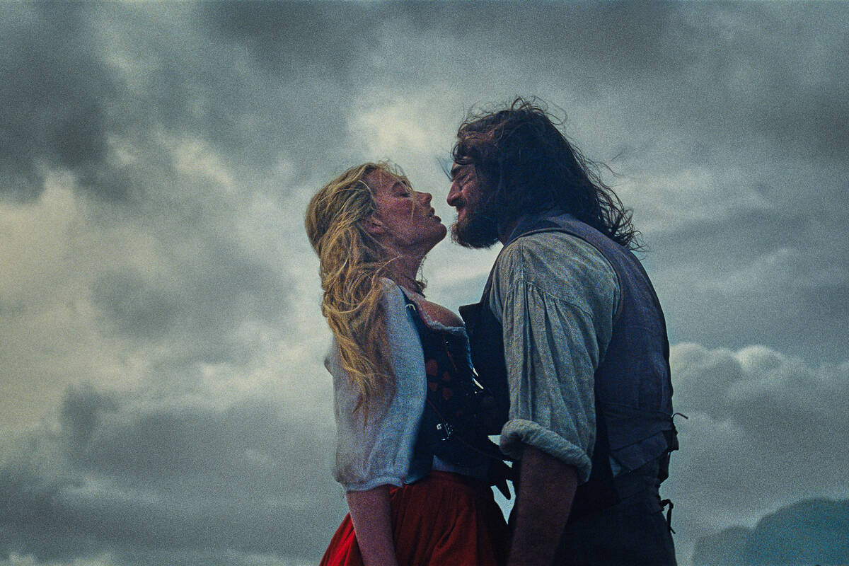 This image released by Warner Bros. Pictures shows Margot Robbie, left, and Jacob Elordi in a s ...