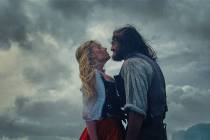 This image released by Warner Bros. Pictures shows Margot Robbie, left, and Jacob Elordi in a s ...