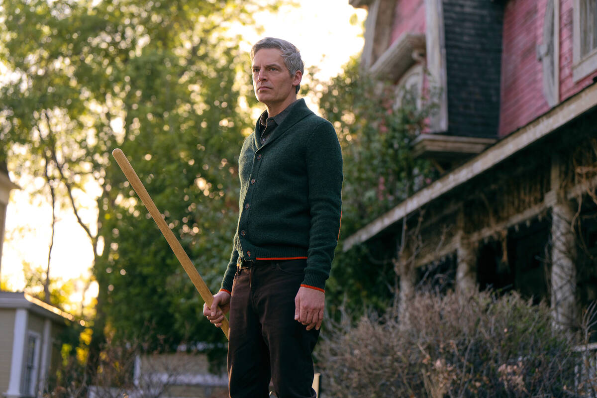 This image released by Peacock shows Justin Kirk in a scene from "The Burbs." (Elizab ...