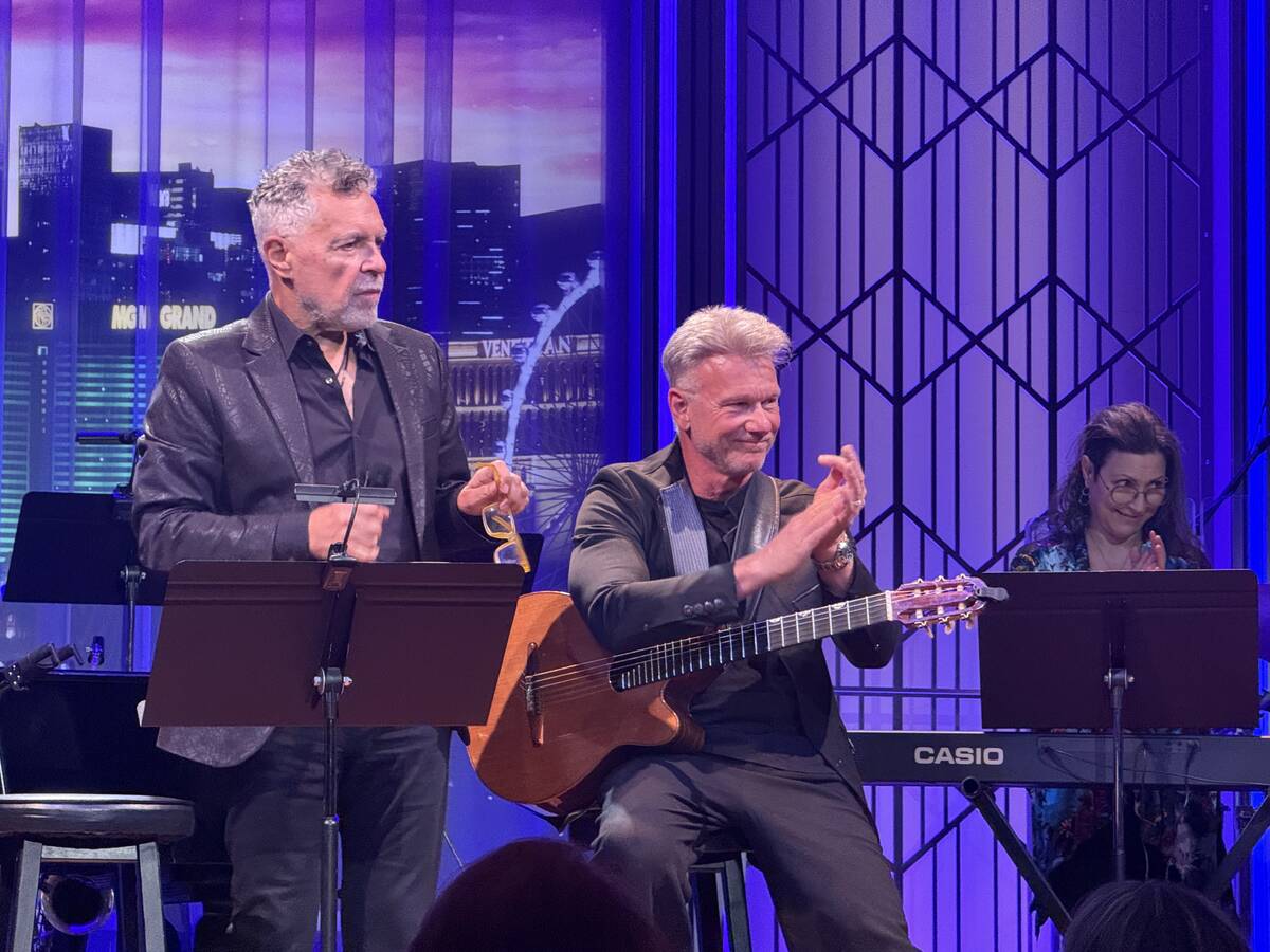 Clint Holmes and Steven Lee are shown performing a Lee original at The Composers Showcase of La ...