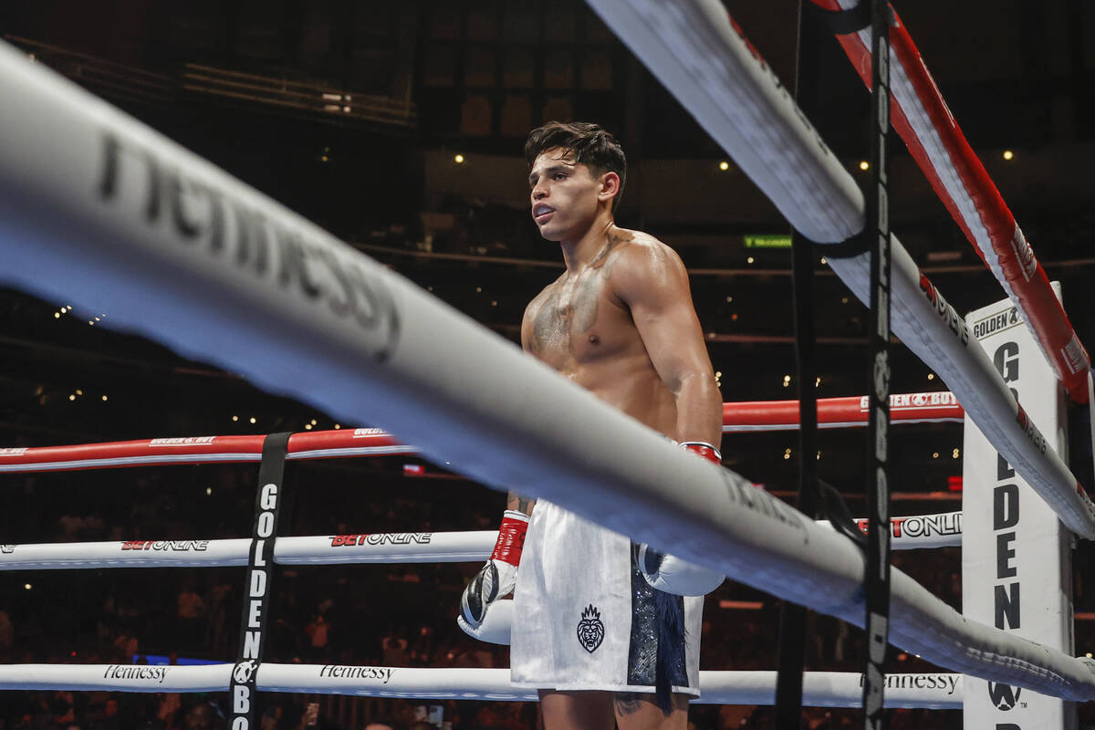 Ryan Garcia waits as Javier Fortuna knees on the canvas after being knocked down during a 12-ro ...