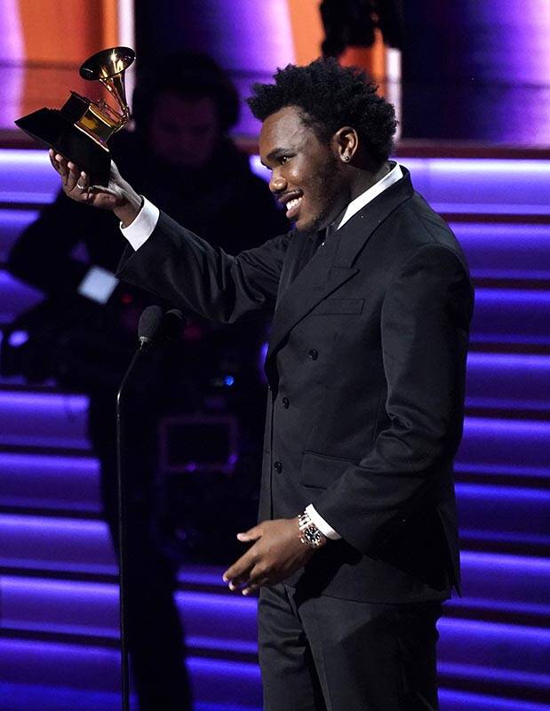 Baby Keem accepts the award for best rap performance for "Family Ties" at the 64th An ...