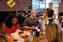Co-owner Natalia Badzjo, right, checks on customers at the original Big B's Texas BBQ, in Hende ...