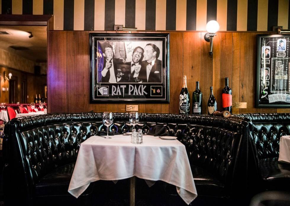 The "Rat Pack" booth is one of the most popular seating options at Golden Steer Steakhouse. Pho ...