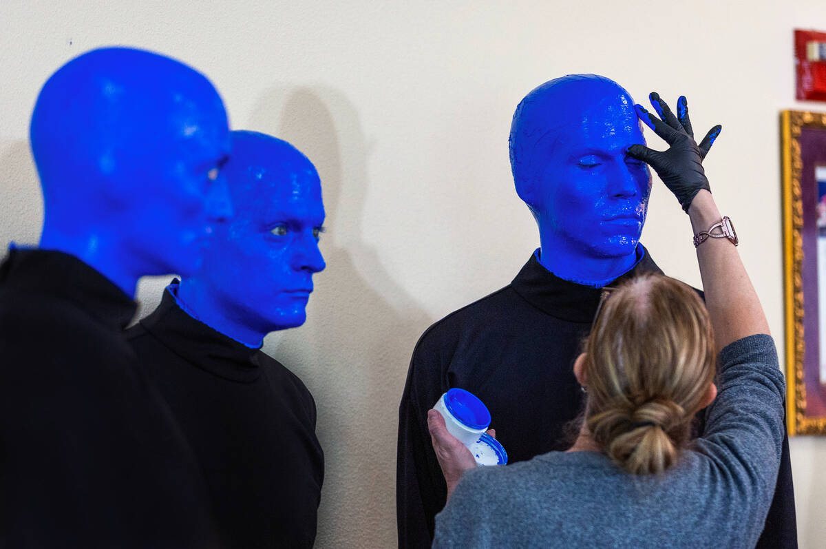 Members of the Blue Man Group have their makeup touched up as the New Kids on the Block announc ...