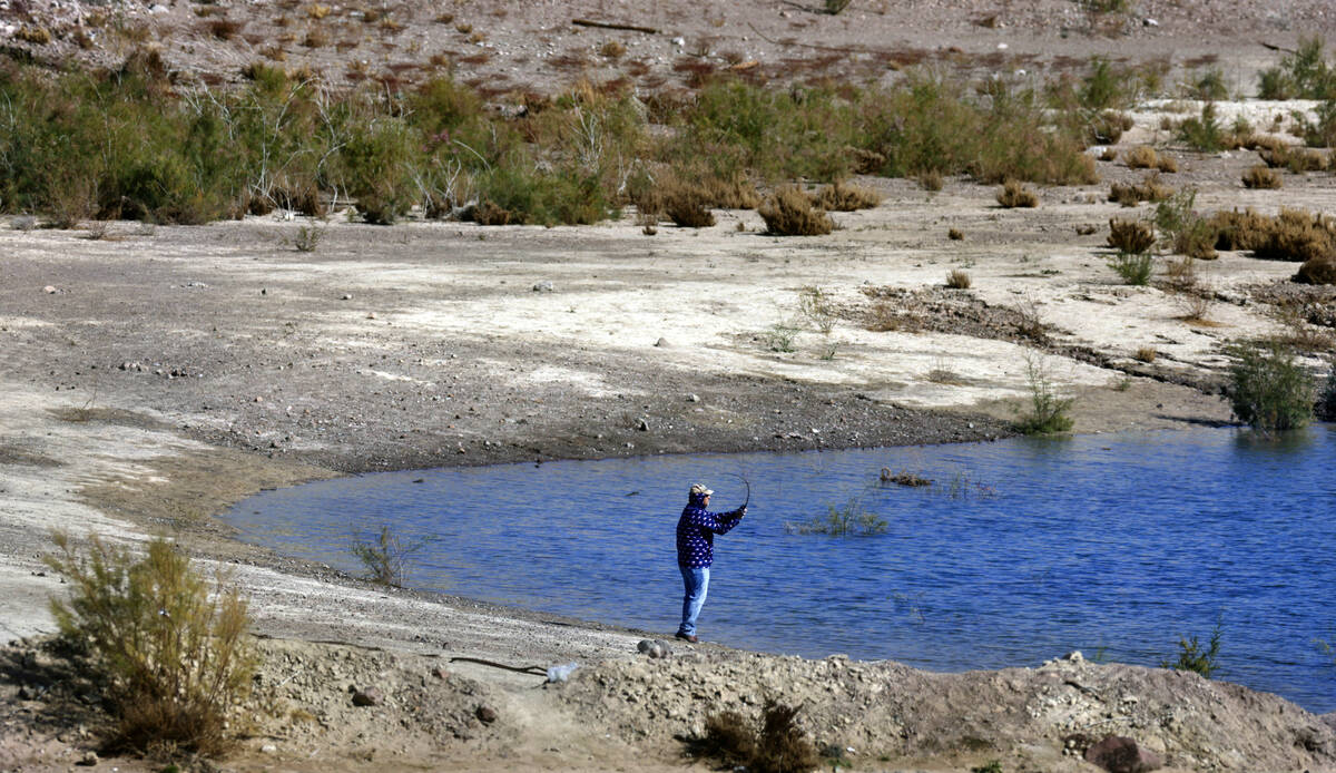 A man fishes in Boulder Harbor within the Lake Mead National Recreation Area on Tuesday, Feb. 1 ...