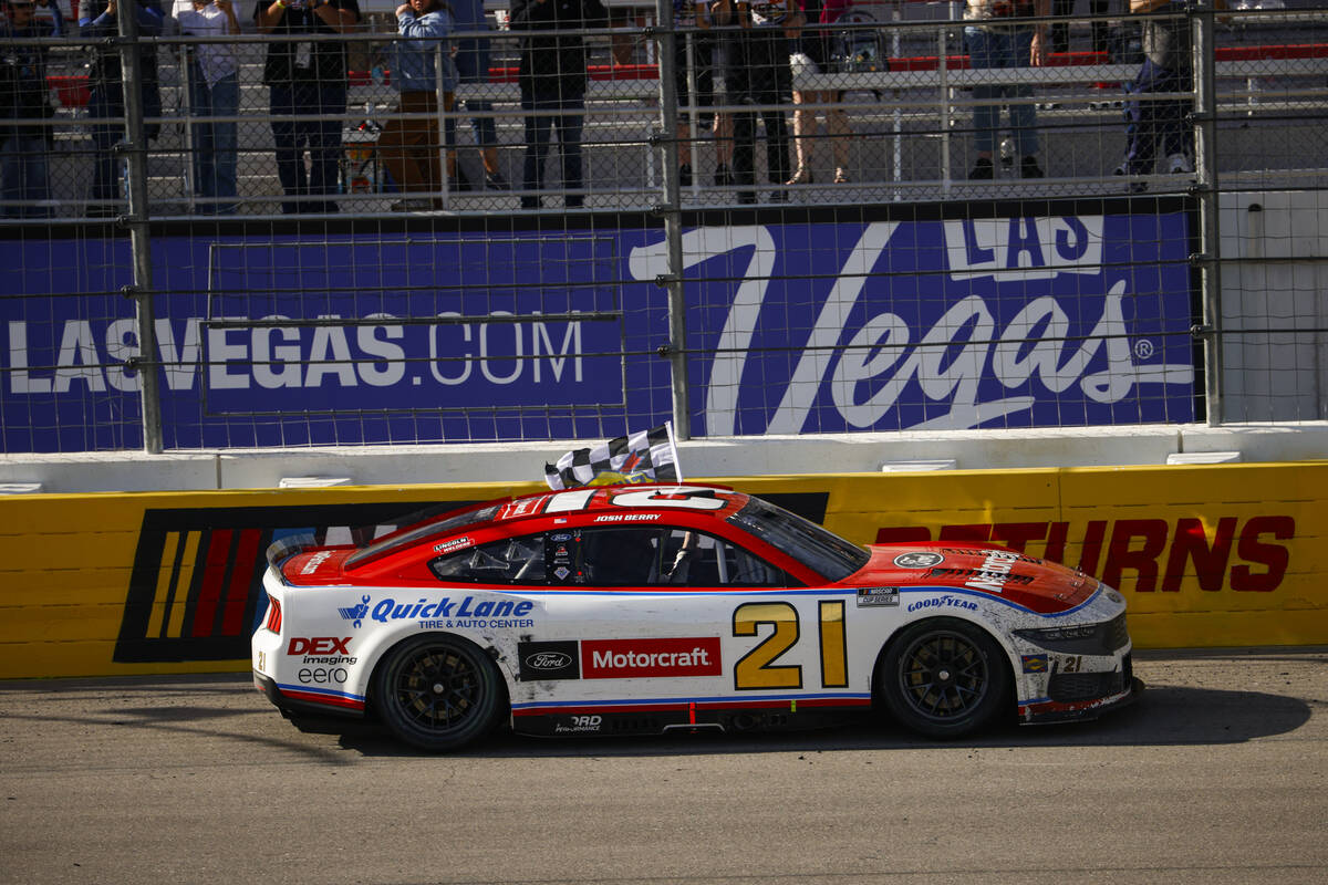 Driver Josh Berry drives with the checkered flag after winning the Pennzoil 400 NASCAR Cup Seri ...