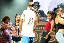 LAS VEGAS, NEVADA - AUGUST 31: Rapper Tone Loc (C) dances with attendees during his performance ...