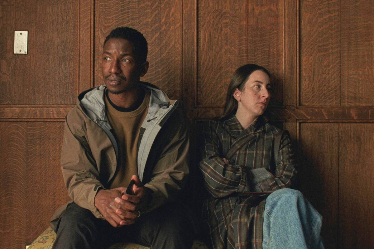 This image released by A24 shows Mamoudou Athie, left, and Alana Haim in a scene from "Th ...
