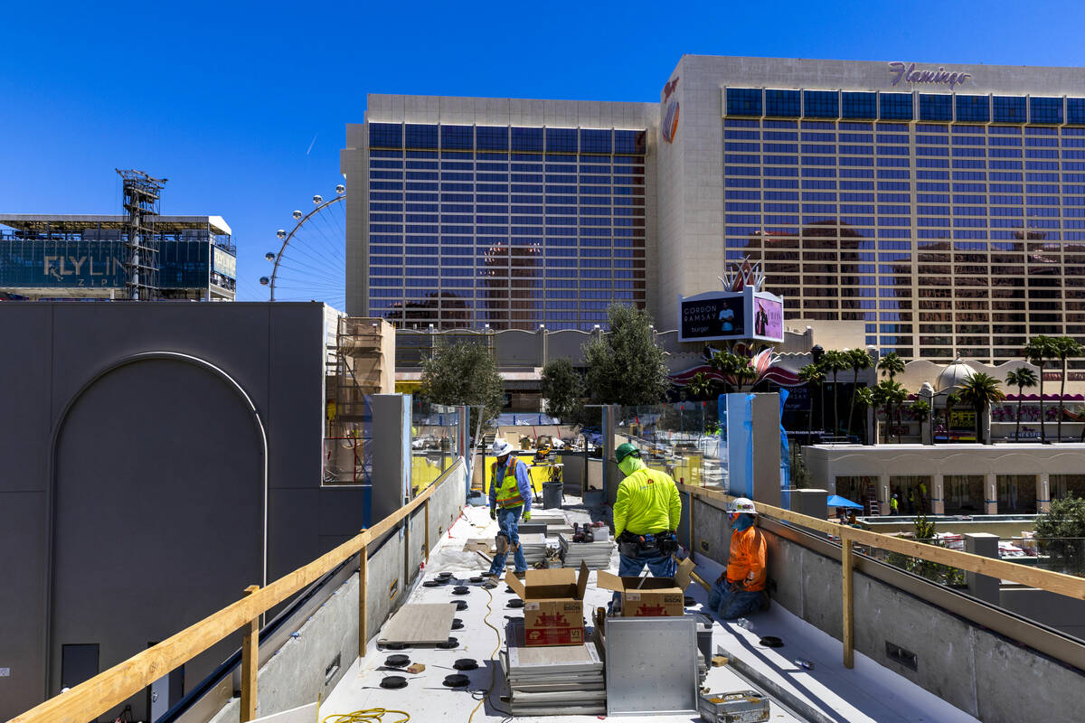 A new pedestrian bridge is completed from the Omnia Nightclub as construction continues on the ...