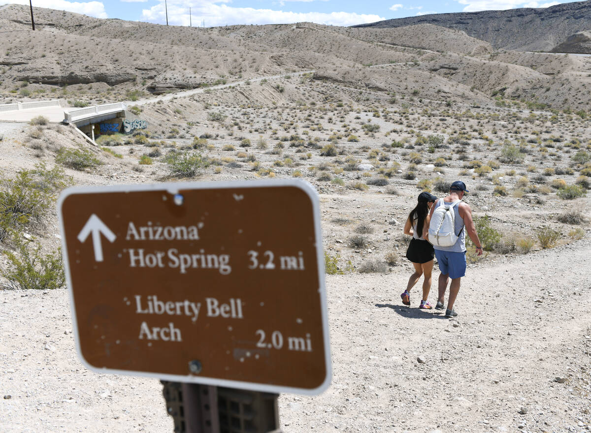Hikers depart from the Arizona Hot Springs trailhead south of the Hoover Dam before the trails ...