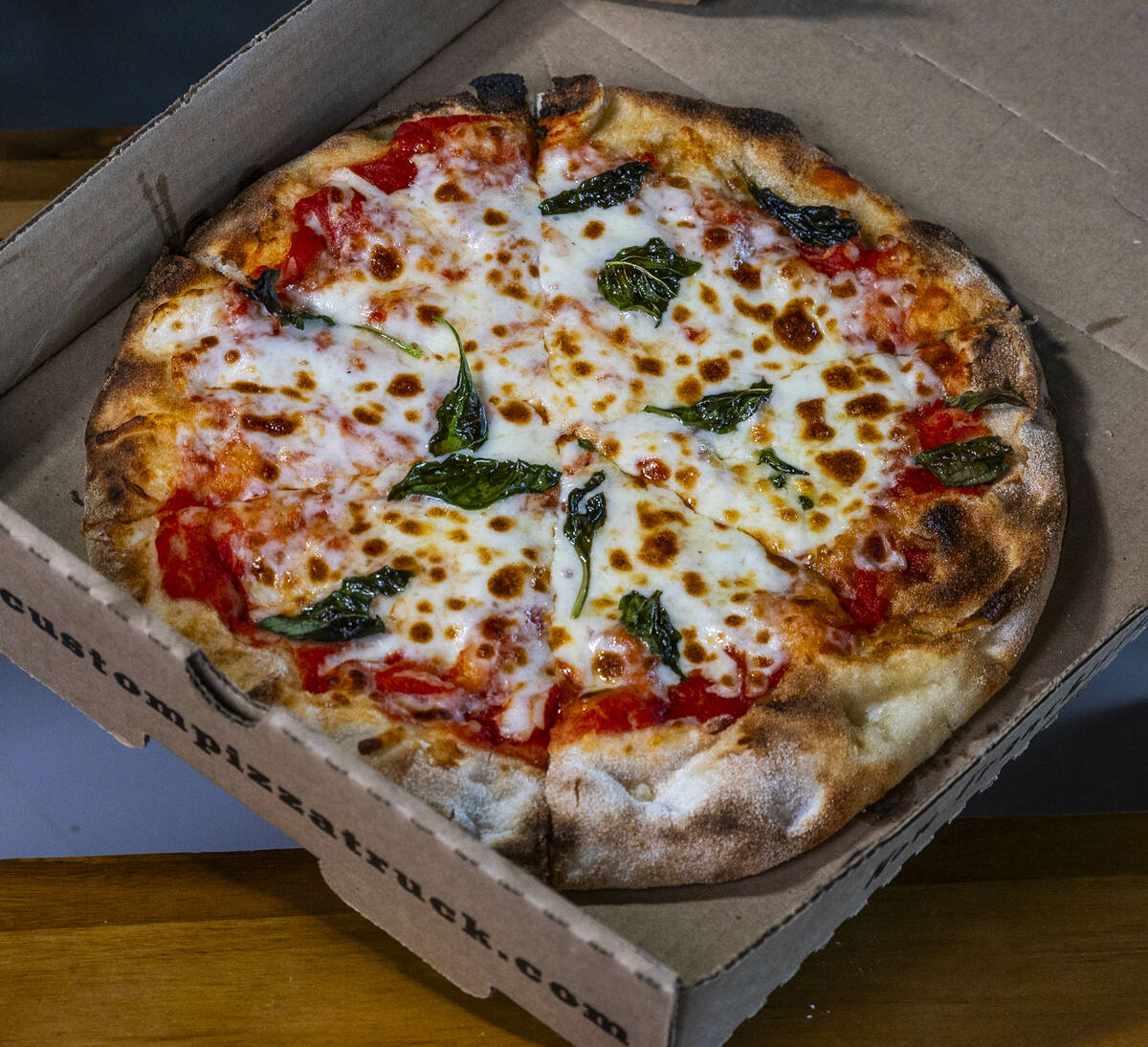 A margherita pizza is one of the new items available from the concessions at the Las Vegas Ball ...