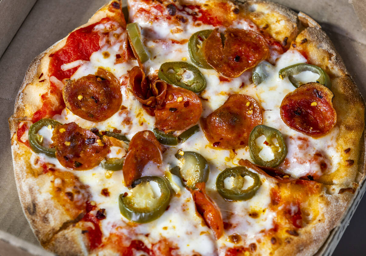 A pepperoni and jalapeño pizza is one of the new items available from the concessions at t ...
