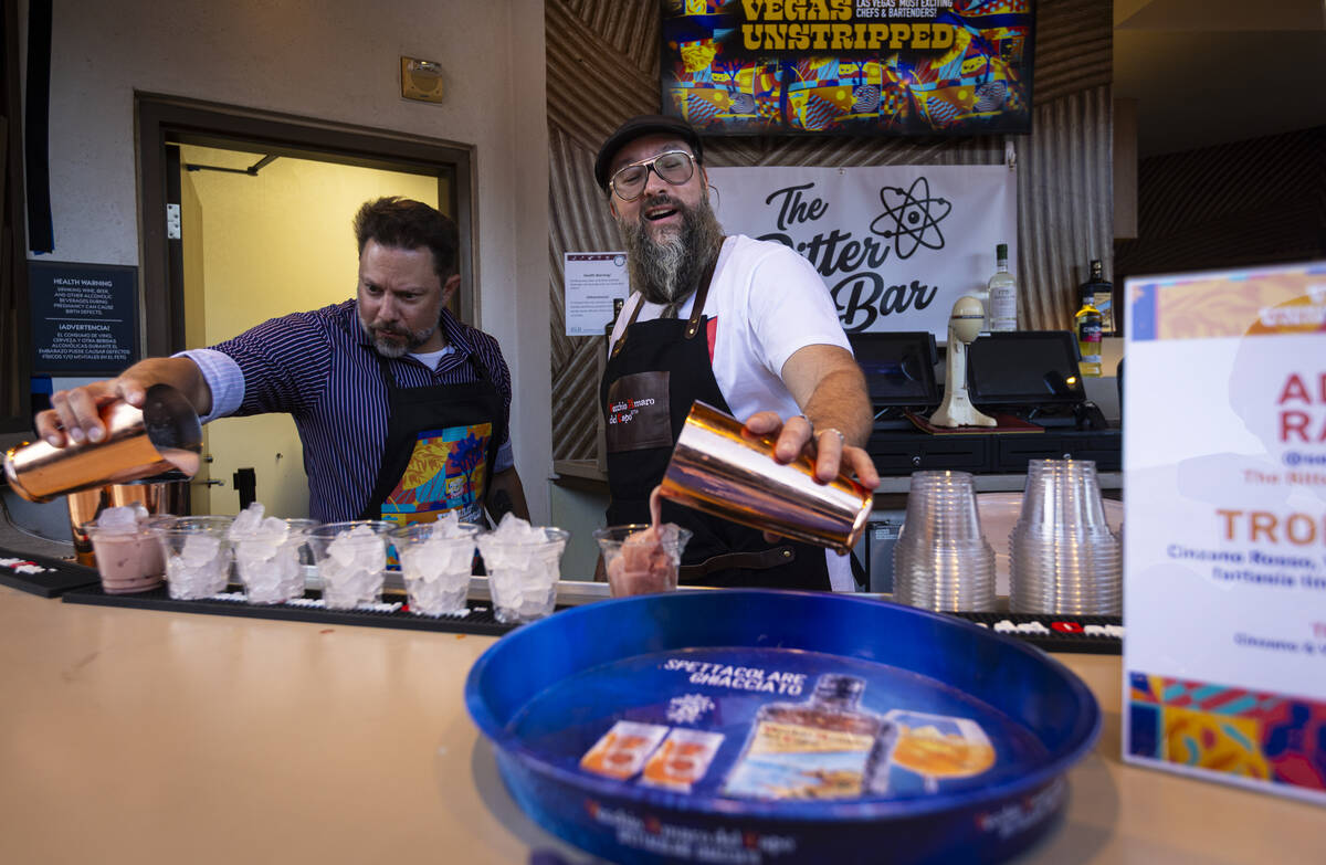 Adam Rains, right, prepares the Tropical G with Cinzano Rosso, Vecchio Amaro del Capo, fantasia ...