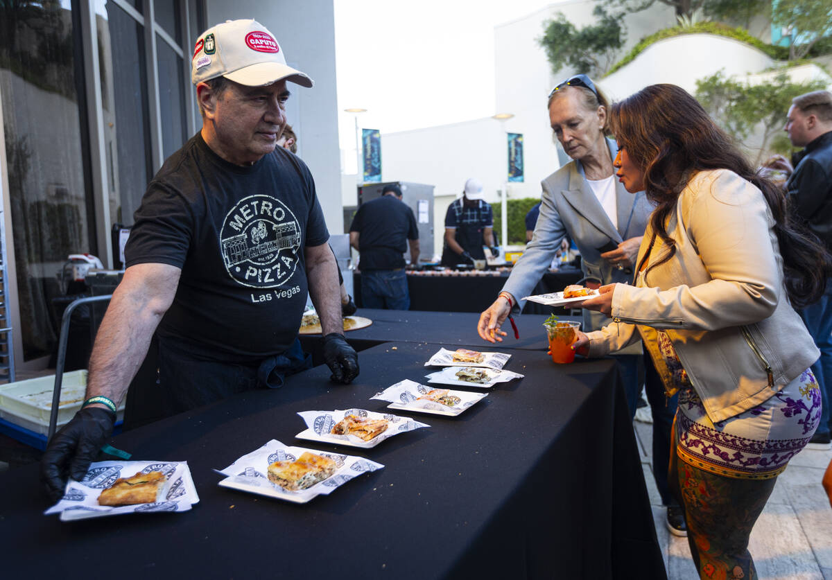 Chef John Arena, co-founder of Metro Pizza, hands out Roman style stuffed pizza with porchetta ...