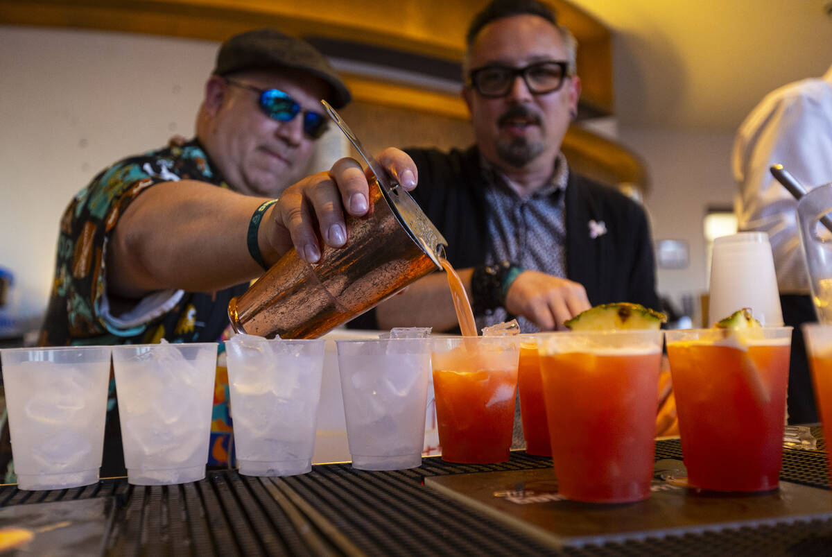 Constantin Alexander and Nicholas Brink of Golden Tiki prepare drinks during Vegas Unstripped a ...
