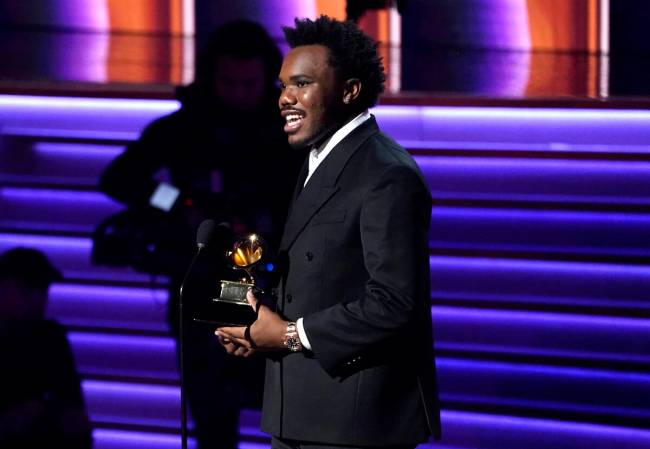 Baby Keem accepts the award for best rap performance for "Family Ties" at the 64th An ...